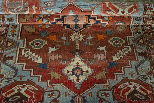 Corner detail of 1930s Heriz rug showing border pattern and Wool pile