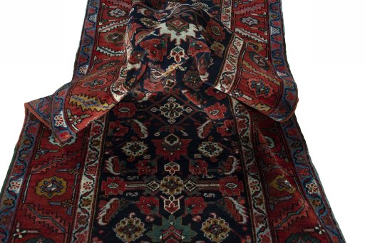 Corner detail of 1930s Heriz rug showing border pattern and Wool pile