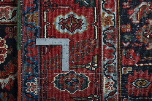 Close-up detail of 1930s Heriz rug from Iran / Persia showing Wool weave
