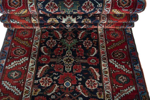 Full view of 1930s Heriz rug from Iran / Persia, 561 × 115 cm in Blue tones