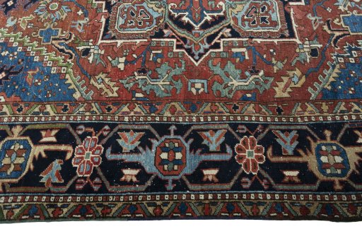 Corner detail of 1930s Heriz rug showing border pattern and Wool pile