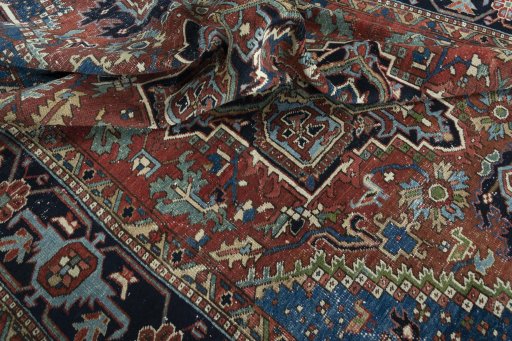 Surface texture of 1930s Heriz rug with natural Wool and intricate pattern