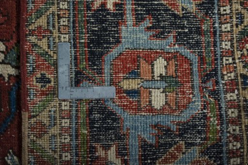 Backside of handmade 1930s Heriz rug showing knot structure and weave density