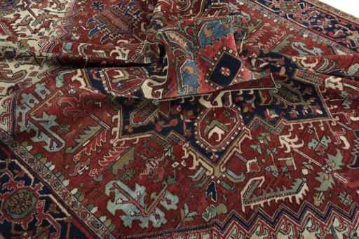 Surface texture of 1930s Heriz rug with natural Wool and intricate pattern