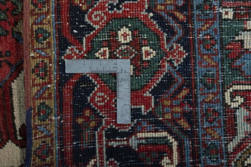 Backside of handmade 1930s Heriz rug showing knot structure and weave density