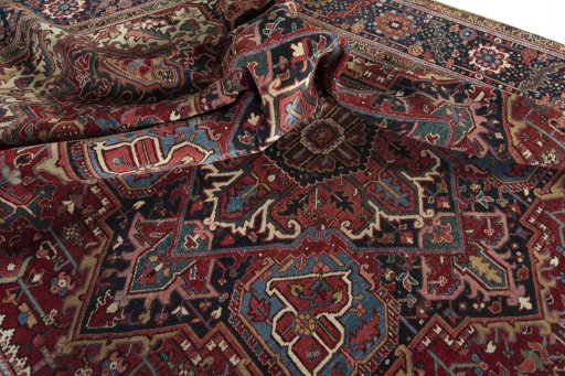 Surface texture of 1930s Heriz rug with natural Wool and intricate pattern
