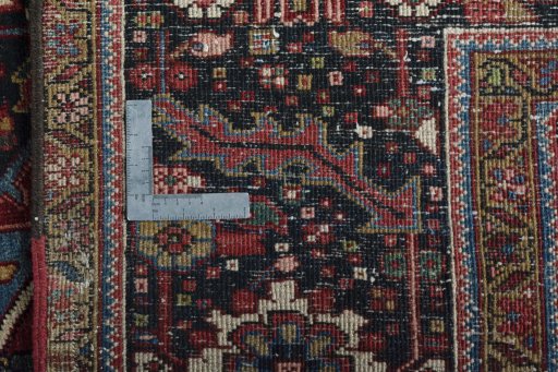 Backside of handmade 1930s Heriz rug showing knot structure and weave density