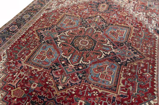 Backside of handmade 1930s Heriz rug showing knot structure and weave density