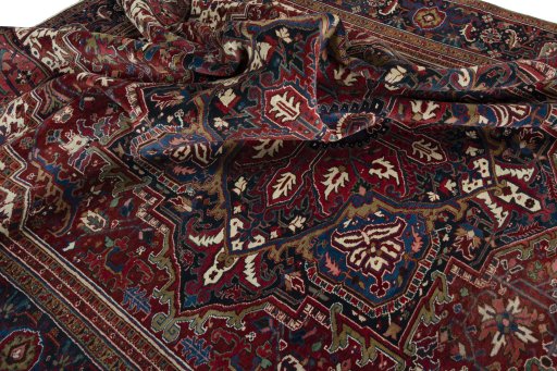 Surface texture of 1930s Heriz rug with natural Wool and intricate pattern