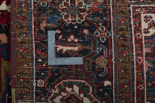 Backside of handmade 1930s Heriz rug showing knot structure and weave density