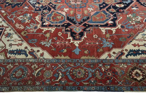 Corner detail of 1930s Heriz rug showing border pattern and Wool pile