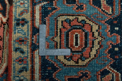 Backside of handmade 1930s Heriz rug showing knot structure and weave density