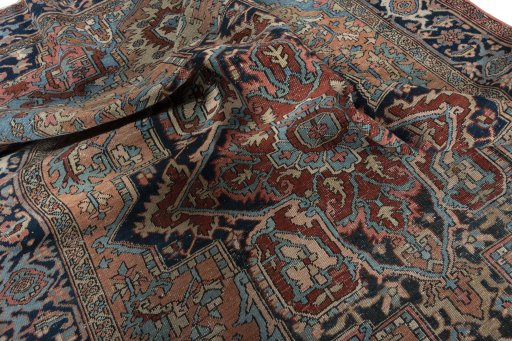 Backside of handmade 1930s Heriz rug showing knot structure and weave density