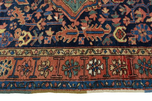 Corner detail of 1930s Heriz rug showing border pattern and Wool pile