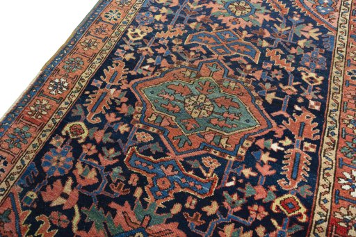 Backside of handmade 1930s Heriz rug showing knot structure and weave density