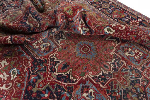 Surface texture of 1930s Heriz rug with natural Wool and intricate pattern