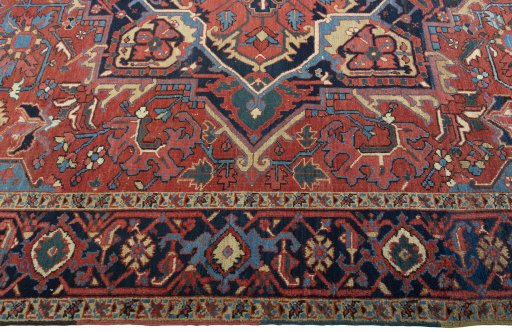 Corner detail of 1930s Heriz rug showing border pattern and Wool pile