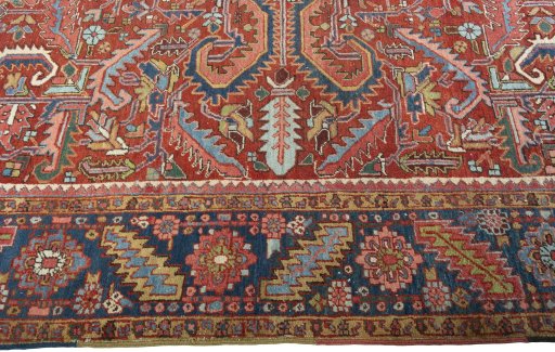 Corner detail of 1930s Heriz rug showing border pattern and Wool pile