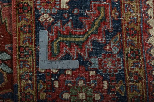 Backside of handmade 1930s Heriz rug showing knot structure and weave density