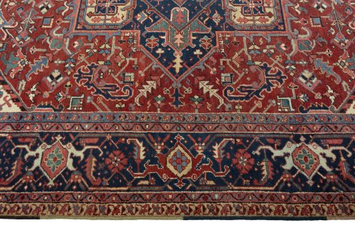 Corner detail of 1930s Heriz rug showing border pattern and Wool pile