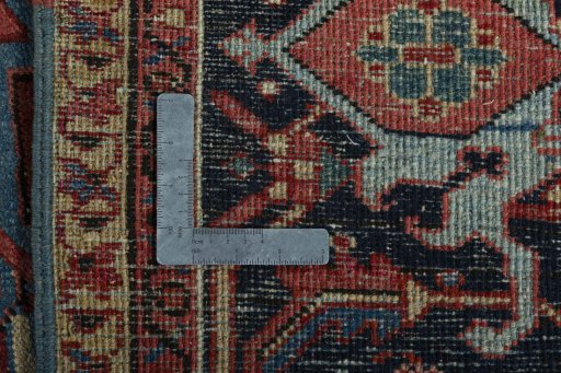 Backside of handmade 1930s Heriz rug showing knot structure and weave density