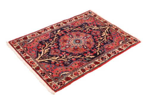 Corner detail of 1920s Heriz rug showing border pattern and Wool pile