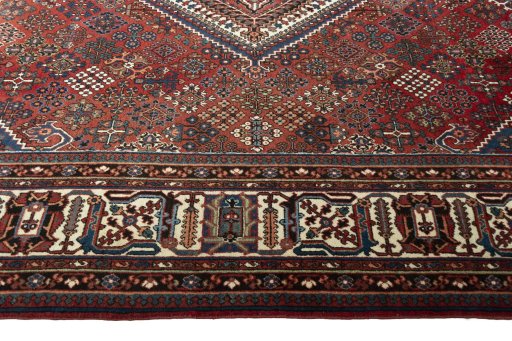 Corner detail of 1970s Joshagan rug showing border pattern and Wool pile