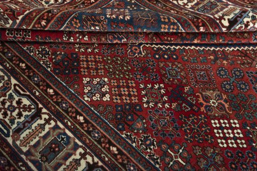 Close-up detail of 1970s Joshagan rug from Iran / Persia showing Wool weave