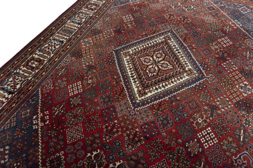 Backside of handmade 1970s Joshagan rug showing knot structure and weave density