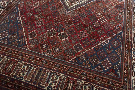 Close-up detail of 1970s Joshagan rug from Iran / Persia showing Wool weave