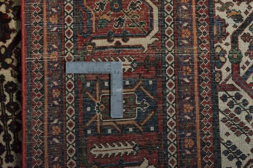 Close-up detail of 1950s Joshagan rug from Iran / Persia showing Wool weave