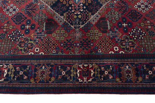 Corner detail of 1970s Joshagan rug showing border pattern and Wool pile