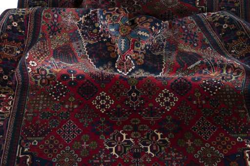 Surface texture of 1970s Joshagan rug with natural Wool and intricate pattern