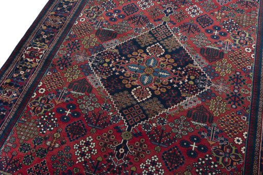 Backside of handmade 1970s Joshagan rug showing knot structure and weave density