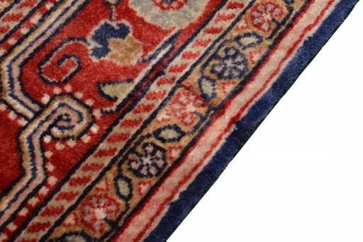 Backside of handmade 2000s Jozan rug showing knot structure and weave density