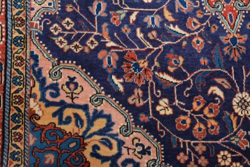 Backside of handmade 2000s Jozan rug showing knot structure and weave density