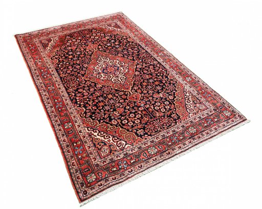 Corner detail of 1970s Jozan rug showing border pattern and Wool pile
