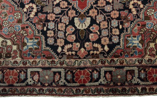 Close-up detail of 1950s Jozan rug from Iran / Persia showing Wool weave