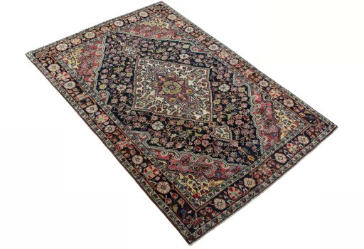 Close-up detail of 1950s Jozan rug from Iran / Persia showing Wool weave