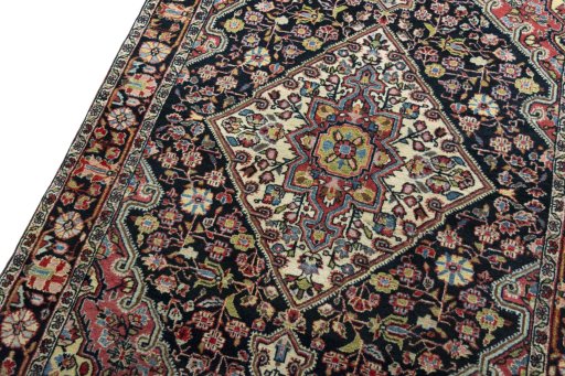 Backside of handmade 1950s Jozan rug showing knot structure and weave density