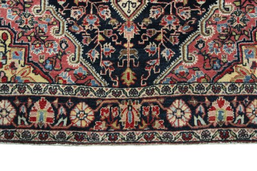 Close-up detail of 1950s Jozan rug from Iran / Persia showing Wool weave