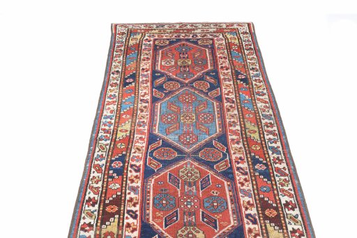 Surface texture of 1900s Kurdi rug with natural Wool and intricate pattern