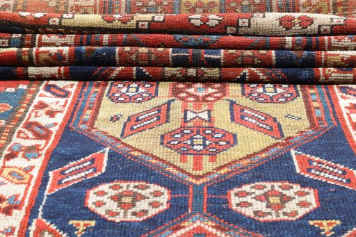 Close-up detail of 1900s Kurdi rug from Iran / Persia showing Wool weave