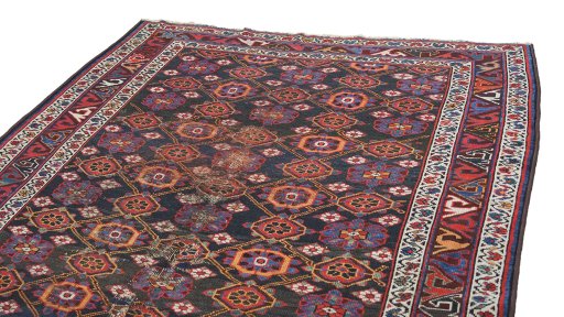 Surface texture of 1990s Kurdi rug with natural Wool and intricate pattern