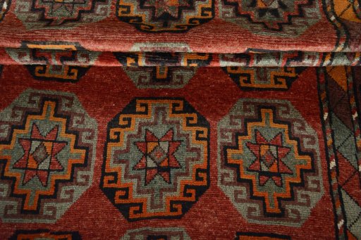Corner detail of 2000s Kurdi rug showing border pattern and Wool pile