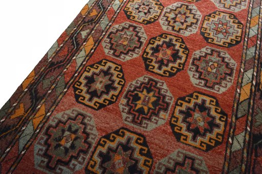 Backside of handmade 2000s Kurdi rug showing knot structure and weave density