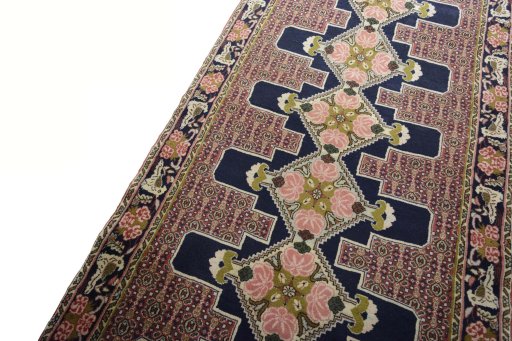 Backside of handmade New Kurdi rug showing knot structure and weave density