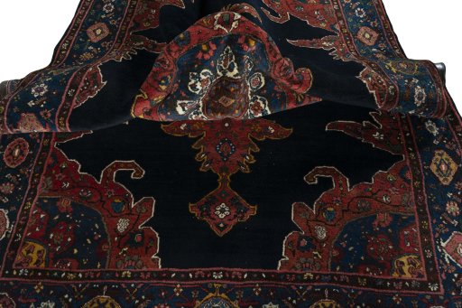 Surface texture of 1950s Kurdi rug with natural Wool and intricate pattern
