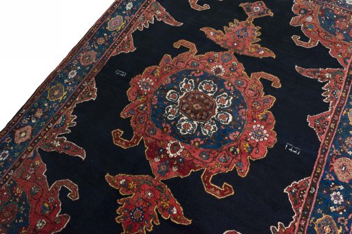 Backside of handmade 1950s Kurdi rug showing knot structure and weave density