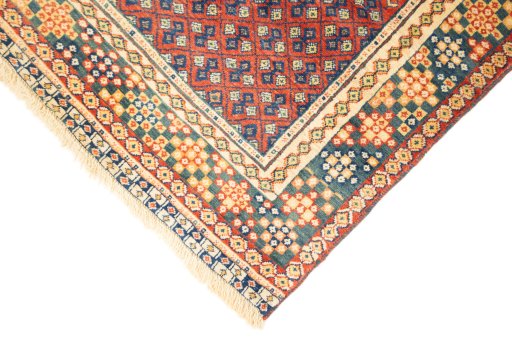 Backside of handmade New Lori rug showing knot structure and weave density